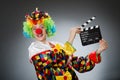 The clown with movie clapper in funny concept Royalty Free Stock Photo