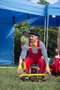 Clown during outdoor performance on Kids Day