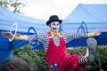 Clown during outdoor performance on Kids Day