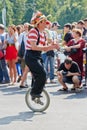 Clown perform on single-wheel bicycle