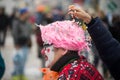 Clown playing with confetti in the street