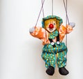 Clown puppet toy on bright background Royalty Free Stock Photo