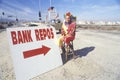 Clown salesperson with Bank Repo sign