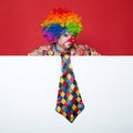 Clown with tie on blank white board Royalty Free Stock Photo