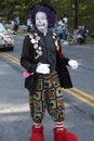 A clown walks in a parade