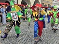 Clowns are marching at a carnival parade