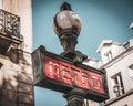 Clsoeup shot of a red Paris metro subway entry sign Royalty Free Stock Photo