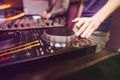 Club DJ playing mixing music on vinyl turntable Royalty Free Stock Photo