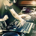 Club DJ playing mixing music on vinyl turntable Royalty Free Stock Photo