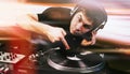 Club DJ playing mixing music on vinyl turntable Royalty Free Stock Photo