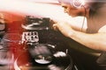 Club DJ playing mixing music on vinyl turntable Royalty Free Stock Photo