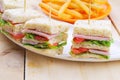 Club Sandwich with Cheese, Pickled Cucumber, Tomato and ham. Gar Royalty Free Stock Photo