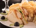 Club sandwich and french fries in a white plate Royalty Free Stock Photo