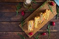 Club sandwich with ham, cheese, tomato and salad. Grilled sandwich with dried tomatoes bread Royalty Free Stock Photo