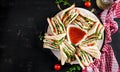 Club sandwich with ham, tomato, cucumber, cheese,  and arugula Royalty Free Stock Photo