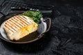 Club sandwich panini with Prosciutto ham. Black background. top view. copy space Royalty Free Stock Photo