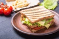 Club sandwich with tomatoes , cucumber , ham and cheese Royalty Free Stock Photo