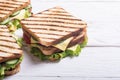 Club sandwich with tomatoes , cucumber , ham and cheese Royalty Free Stock Photo