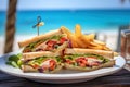 Club sandwiches in a outdoor beach restaurant food setting