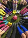 Club soccer team sitting around a soccer ball Royalty Free Stock Photo