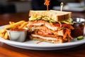 a clubhouse sandwich with plentiful sauces oozing out Royalty Free Stock Photo