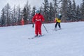 ClubMed Les Arcs Panorama, Les arcs, France - 15.02.2022 : Ski instructor and boy in the french ski resort on mountain Royalty Free Stock Photo