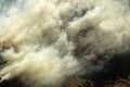 Clubs acrid smoke of burning hay background