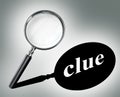 Clue word mystery concept with magnifying glass Royalty Free Stock Photo