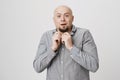 Clueless puzzled bald man with beard and opened mouth being stunned and confused, expressing uncertainty. Facial Royalty Free Stock Photo
