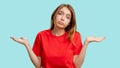 Clueless woman portrait whatever gesture shrugging Royalty Free Stock Photo