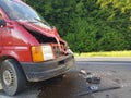 Cluj-Napoca, May, 13, 2017 Red van with front damaged as an result of accident. Front bumper, hood, headlight, mask, grill damaged