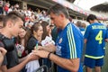 Fottball player signing autographs