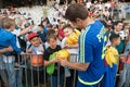 Fottball player signing autographs