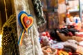 CLUJ-NAPOCA, ROMANIA - NOVEMBER 23, 2018: Romanian flag colors in form of a heart at the Christmas market in the Unirii Square,