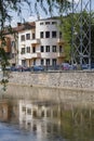 Buildings mirrored in the Somes River on August 21, 2018 in Cluj-Napoca