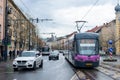 CLUJ-NAPOKA, ROMANIA - April 27, 2022. Tram Astra and trolleybus Astra riding with passengers in the streets of Cluj-Napoka.