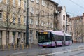 CLUJ-NAPOKA, ROMANIA - April 27, 2022. Trolleybus Solaris Trollino 18 #303 riding with passengers in the streets of Cluj-Napoka.