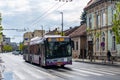 CLUJ-NAPOKA, ROMANIA - April 27, 2022. Trolleybus Solaris Trollino 18 #309 riding with passengers in the streets of Cluj-Napoka.