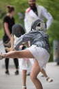 Girls fencing and practicing with sword