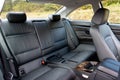 Rear view inside Mazda CX-5 SUV - white leather upholstery, passenger backseat