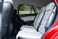 Rear view inside Mazda CX-5 SUV - white leather upholstery, passenger backseat