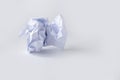 A clump of crumpled white paper on a white background