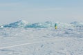 Clumps of blue ice on the snow. Royalty Free Stock Photo