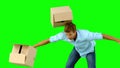 Clumsy man dropping boxes over on green screen