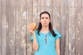 Clumsy Woman Staining Her Shirt with Ketchup Sauce Royalty Free Stock Photo