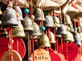 a number of bells hanging from a ceiling with oriental writing on them Royalty Free Stock Photo