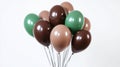 Cluster of brown and green balloons on white background Royalty Free Stock Photo