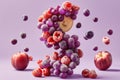 A cluster of frozen grapes and raspberries forms a unique shape against a purple background. Scattered fruit adds to the