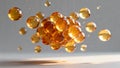 Cluster of glossy amber spheres floating in midair on a soft grey background. Royalty Free Stock Photo
