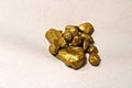 Cluster of gold nuggets mined from earth